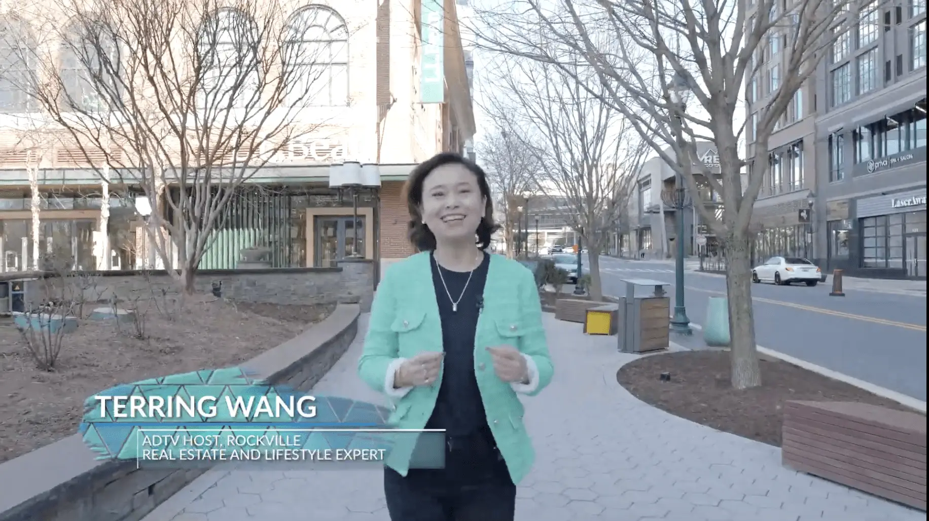 Woman walking in urban outdoor setting.